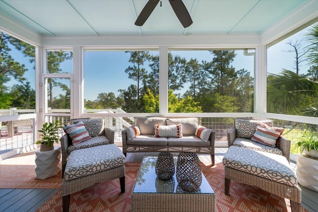 sunroom / solarium with outdoor lounge area, plenty of natural light, and ceiling fan