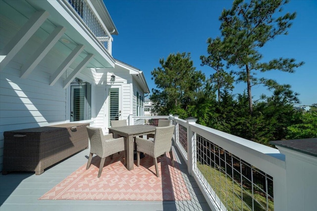 balcony featuring outdoor dining area