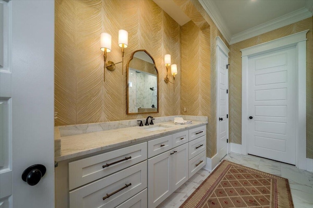 bathroom featuring marble finish floor, vanity, ornamental molding, and a shower