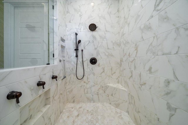 full bathroom with a tile shower