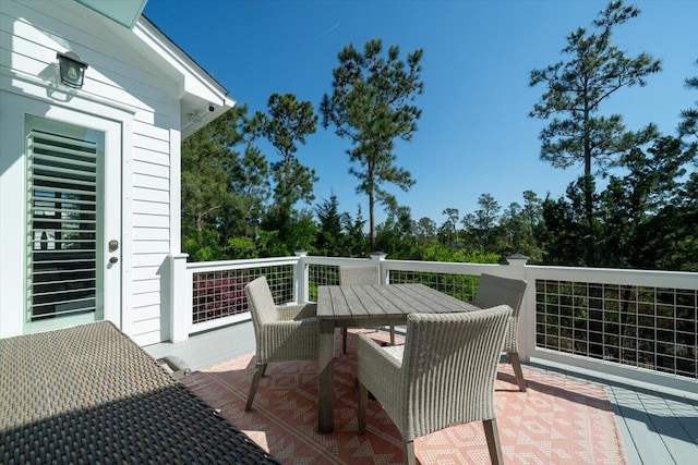 wooden deck with outdoor dining area