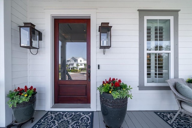 view of exterior entry with covered porch