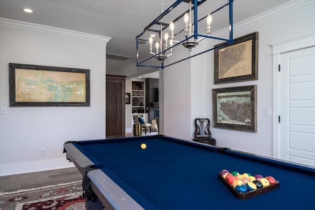 rec room featuring wood finished floors, visible vents, pool table, and ornamental molding