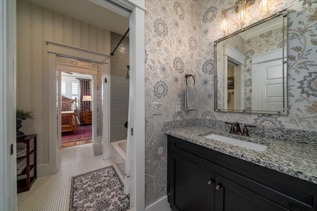 bathroom featuring bathing tub / shower combination and vanity