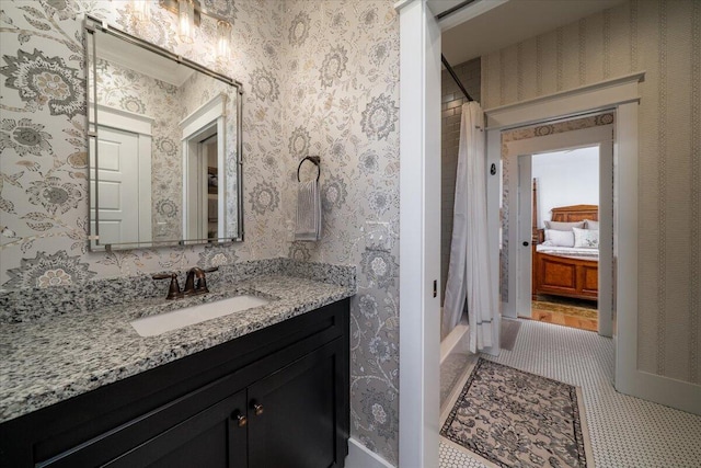bathroom with shower / bath combo, tile patterned flooring, and vanity