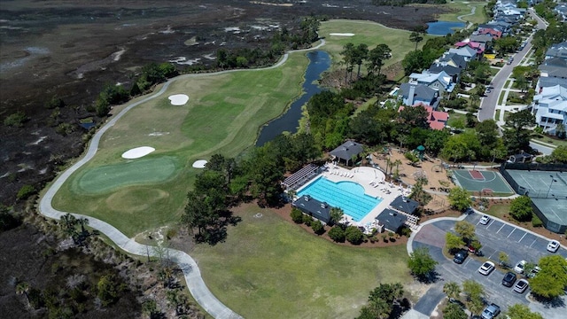 bird's eye view featuring a water view and golf course view
