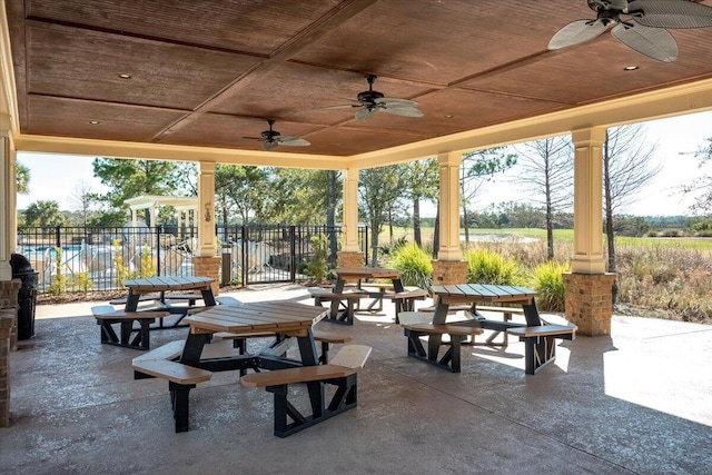 view of patio / terrace with fence and ceiling fan