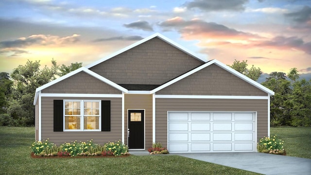 view of front facade with an attached garage, driveway, and a yard