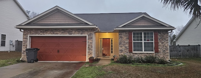 view of front of house with a garage, stone siding, fence, and concrete driveway