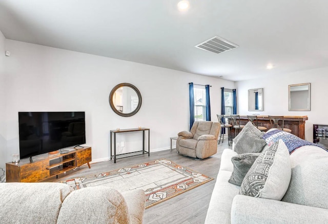 living room with light hardwood / wood-style flooring