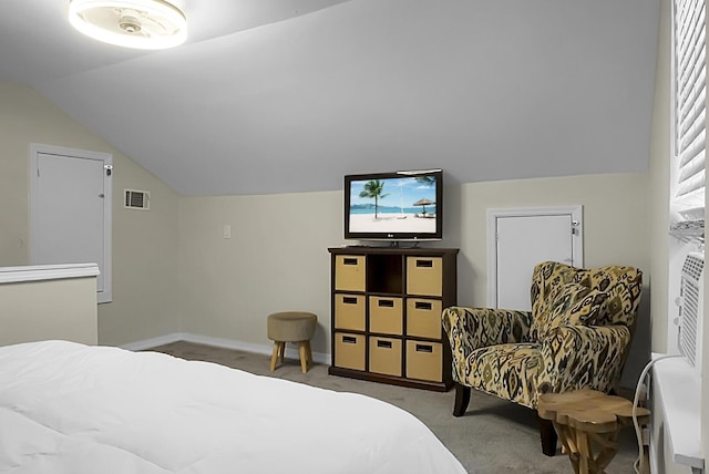 bedroom featuring lofted ceiling, carpet, visible vents, and baseboards