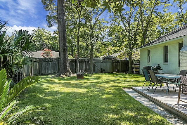 view of yard featuring a patio area and a fenced backyard