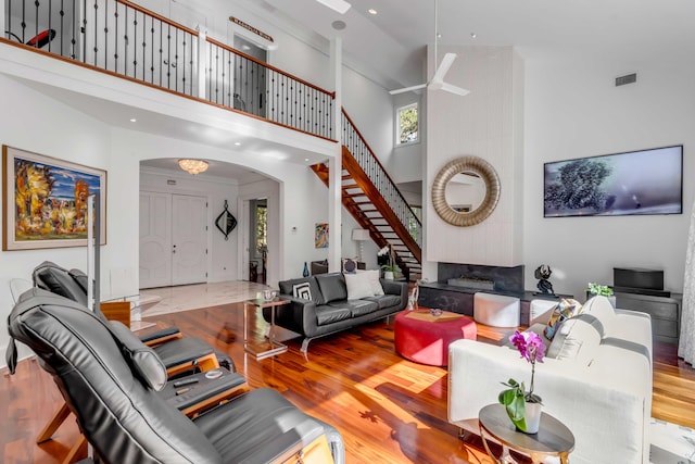 371 Live Palmetto Blf, Mount Pleasant, SC 29464 - living room featuring a towering ceiling and light hardwood / wood-style floors