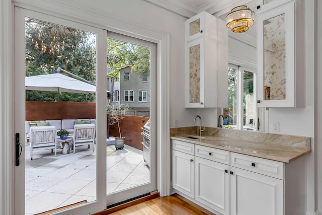 371 Live Palmetto Blf, Mount Pleasant, SC 29464 - entryway featuring light hardwood / wood-style floors, ornamental molding, and sink