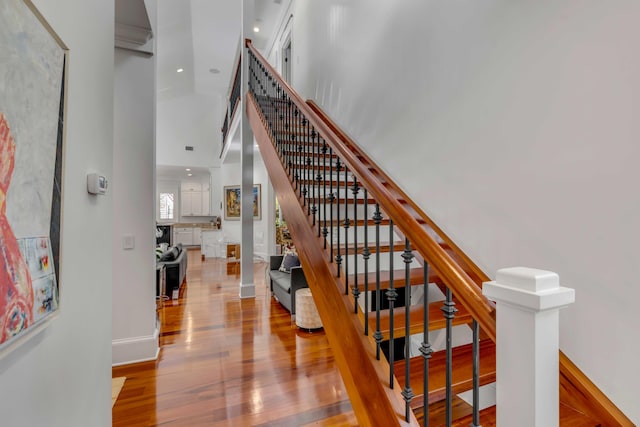 371 Live Palmetto Blf, Mount Pleasant, SC 29464 - staircase with hardwood / wood-style floors and a high ceiling