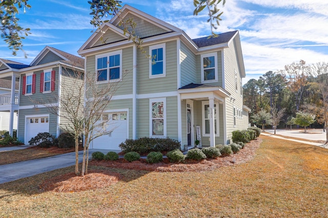 view of front of house with a front lawn and a garage