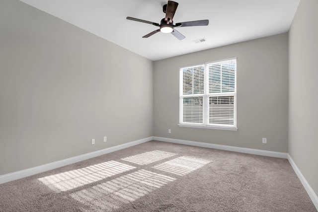 carpeted empty room with ceiling fan