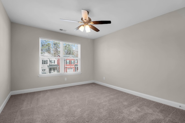 unfurnished room with ceiling fan and carpet floors