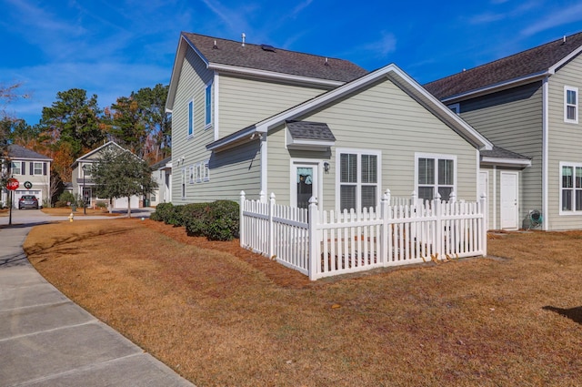 view of home's exterior with a lawn