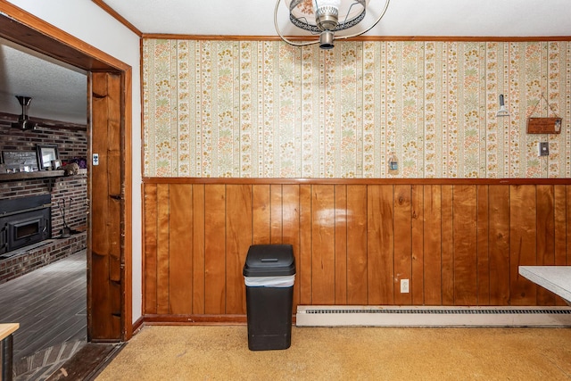 interior space featuring crown molding and a baseboard radiator