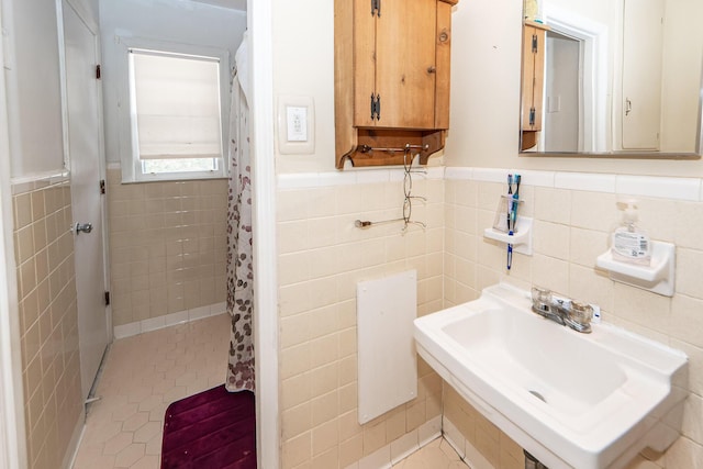 bathroom featuring sink, tile walls, tile patterned floors, and a shower with curtain