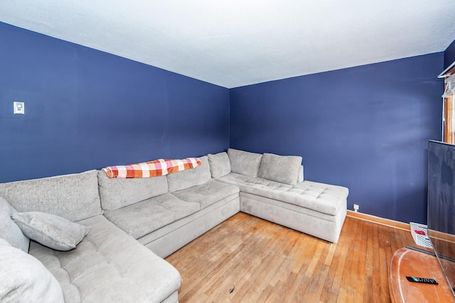 unfurnished living room with hardwood / wood-style flooring