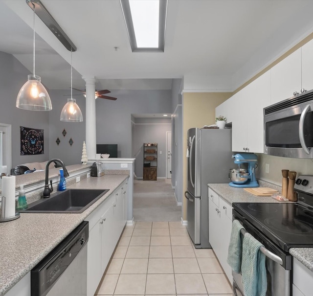 2632 Egret Crest Ln, Charleston, SC 29414 - kitchen with appliances with stainless steel finishes, a sink, light countertops, white cabinets, and light tile patterned floors
