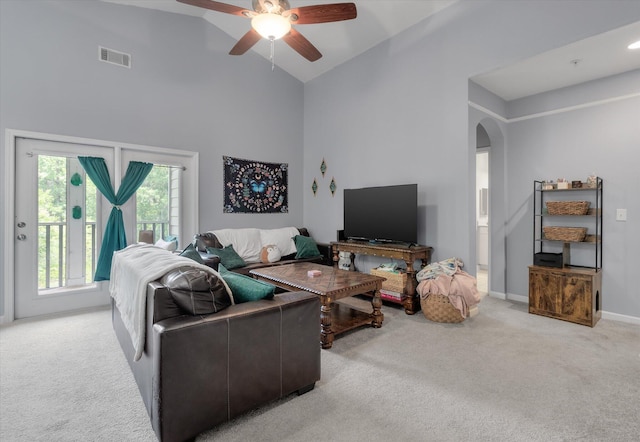 2632 Egret Crest Ln, Charleston, SC 29414 - living area featuring light carpet, arched walkways, a ceiling fan, high vaulted ceiling, and baseboards