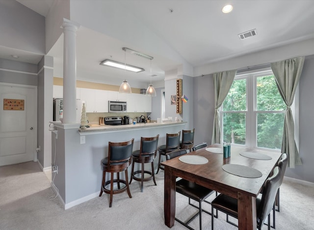 2632 Egret Crest Ln, Charleston, SC 29414 - dining space featuring light carpet, baseboards, and ornate columns