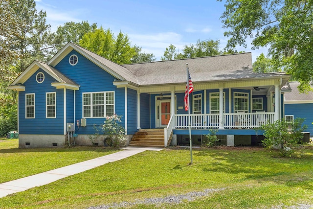 view of front facade featuring crawl space, covered porch, a front yard, a ceiling fan, and a shingled roof