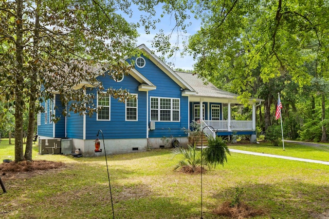 view of front of house featuring crawl space, covered porch, a front yard, and cooling unit