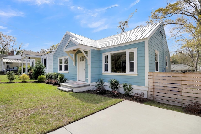 bungalow-style home featuring a front yard