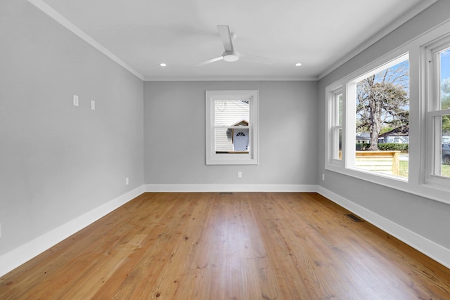 empty room featuring light hardwood / wood-style floors, crown molding, and ceiling fan