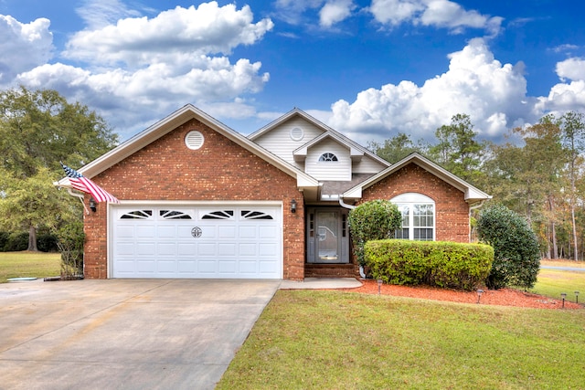 view of property featuring a garage and a front lawn