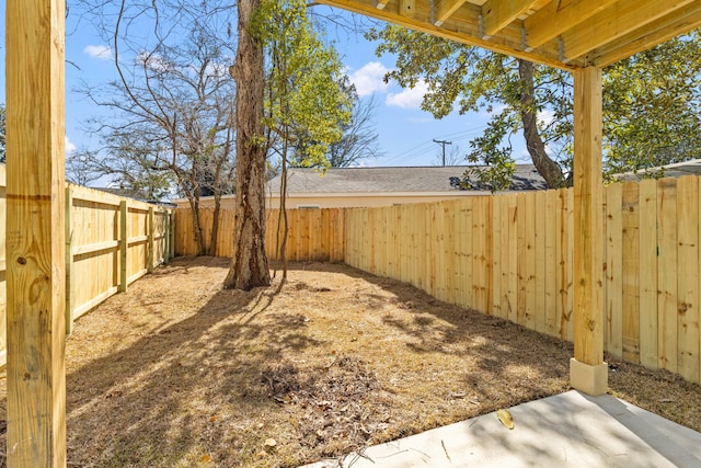 view of yard with a fenced backyard