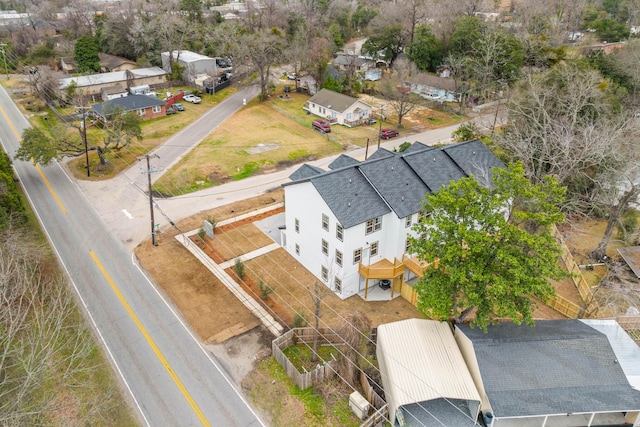 birds eye view of property with a residential view