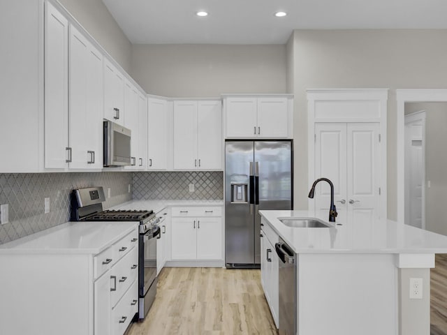 253 River Martin Ct, Summerville, SC 29483 - kitchen featuring white cabinetry, light countertops, a sink, and appliances with stainless steel finishes