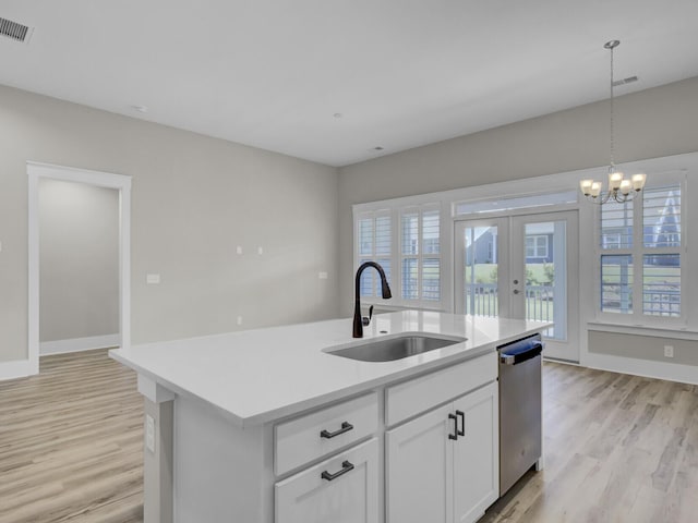 253 River Martin Ct, Summerville, SC 29483 - kitchen featuring light countertops, dishwasher, a sink, light wood-type flooring, and french doors