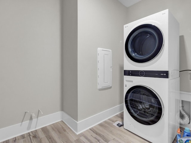 253 River Martin Ct, Summerville, SC 29483 - washroom featuring baseboards, wood finished floors, stacked washer / drying machine, and laundry area