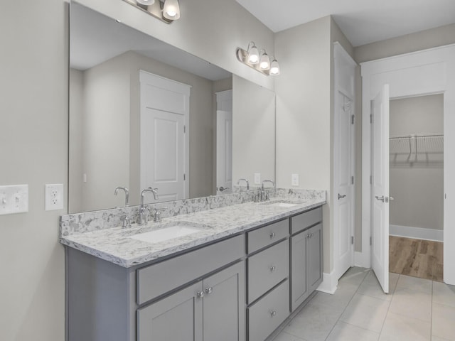 253 River Martin Ct, Summerville, SC 29483 - full bath featuring double vanity, a sink, tile patterned floors, and baseboards