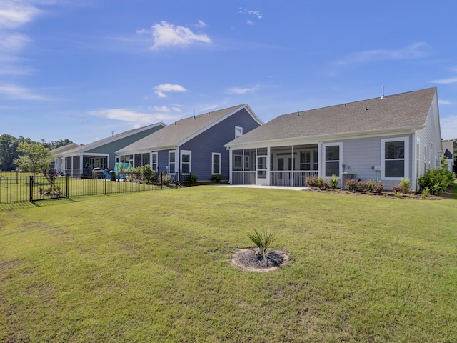253 River Martin Ct, Summerville, SC 29483 - rear view of property with a lawn, a sunroom, fence, and roof with shingles