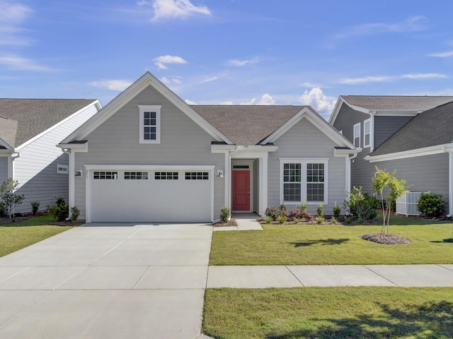 253 River Martin Ct, Summerville, SC 29483 - view of front of house with a shingled roof, a front yard, an attached garage, and concrete driveway