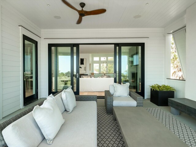 view of patio with a ceiling fan and an outdoor living space