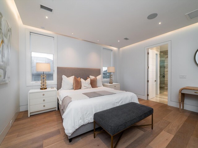 bedroom featuring recessed lighting, visible vents, and light wood-style flooring