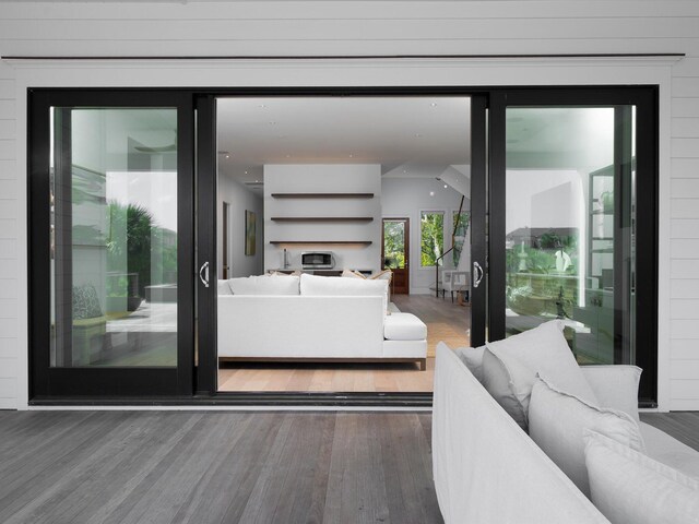 living area with recessed lighting and wood finished floors