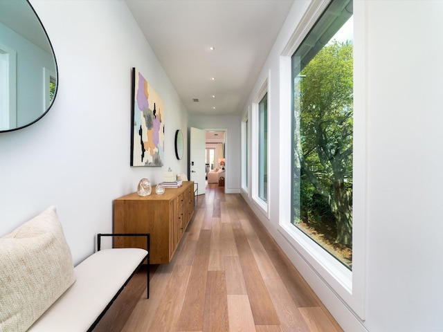 corridor featuring recessed lighting and light wood-style flooring