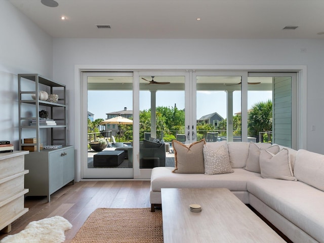 living area featuring ceiling fan, french doors, visible vents, wood finished floors, and recessed lighting