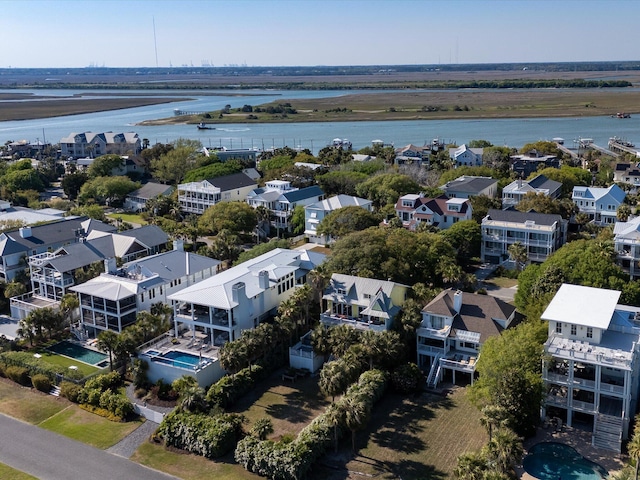 bird's eye view featuring a water view and a residential view