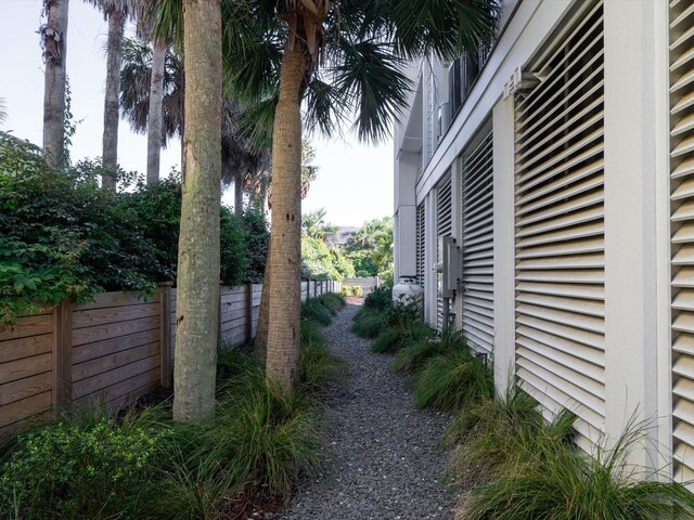 view of home's exterior with fence