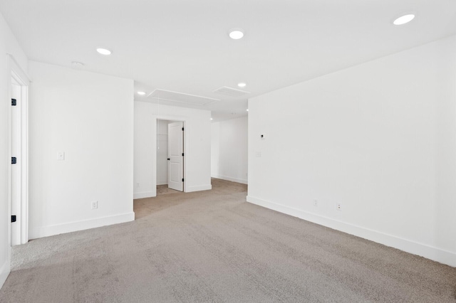 empty room featuring light colored carpet